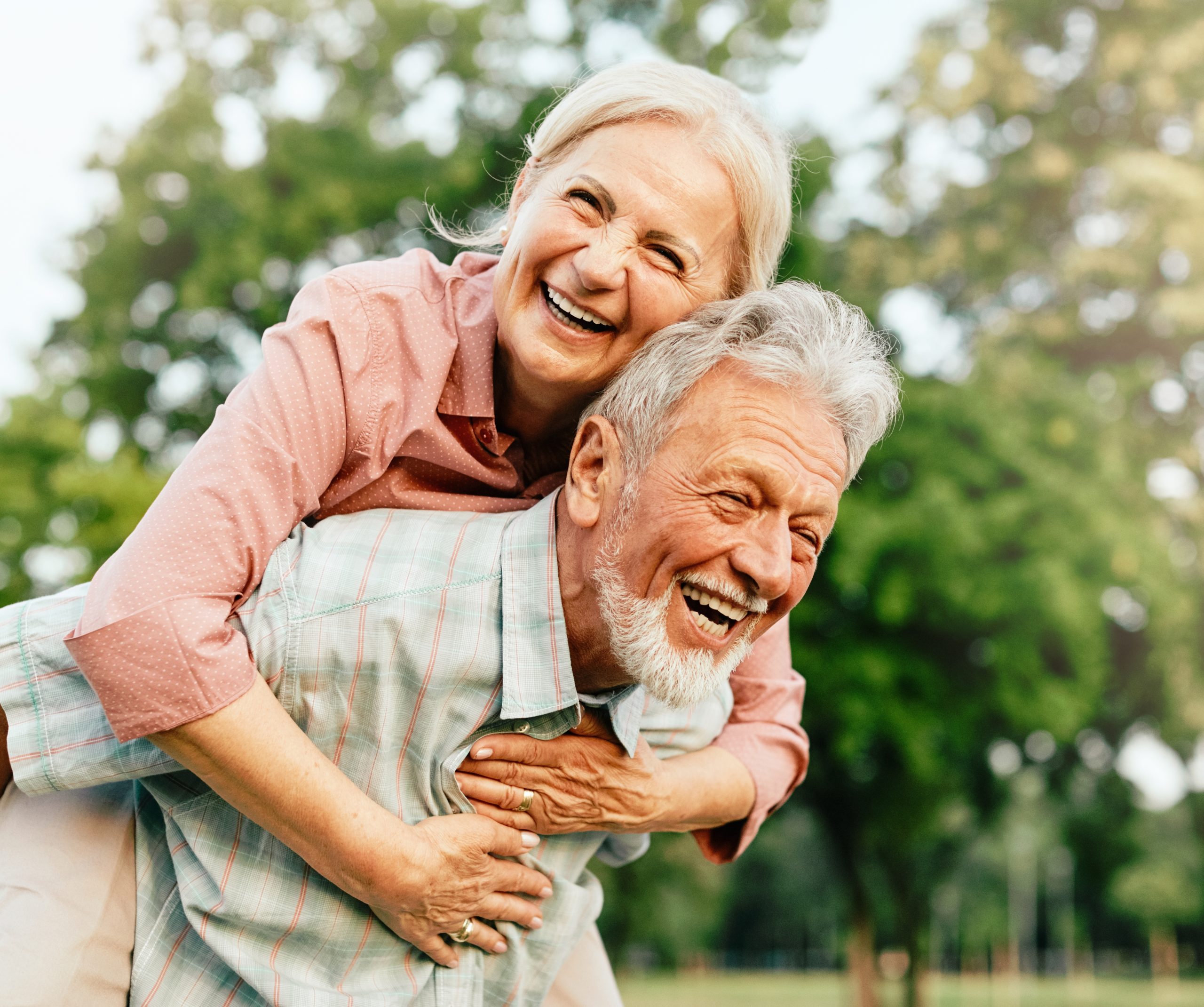 Happy,Active,Senior,Couple,Having,Fun,Outdoors.,Portrait,Of,An Active Baby Boomer couple enjoying life outdoors